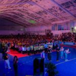 Estudantes reunidos no Ginásio JK durante a abertura da OILEM em setembro de 2026